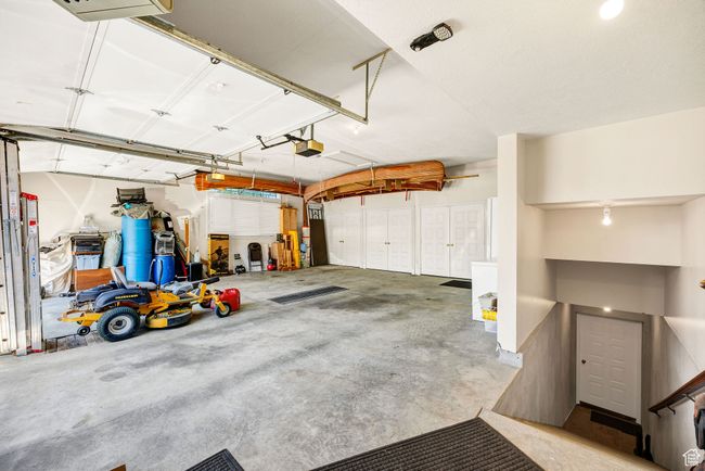 Garage featuring a garage door opener | Image 69