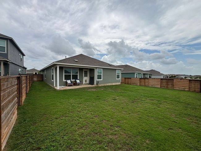 Back of property with a patio and a fenced backyard | Image 6
