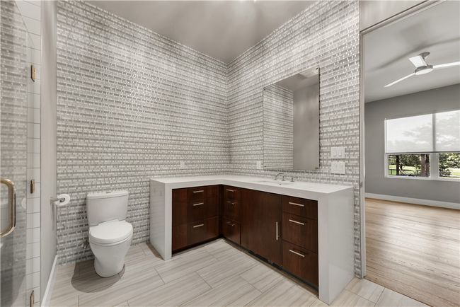 Bathroom featuring vanity, a stall shower, a ceiling fan, and wallpapered walls | Image 23