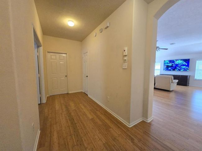 gallery hallway walking out to the family room | Image 20