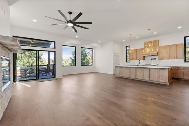 View from entry of Great Room, including living/family room, dining room, and kitchen | Image 13