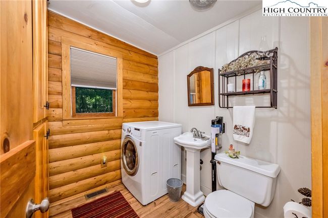 1/2 bath on the main level with laundry. | Image 22