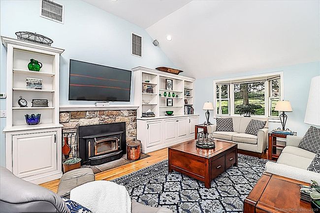 Living Room with Custom Built-ins and Wood Stove ~ Great for Cozy Evenings! | Image 11