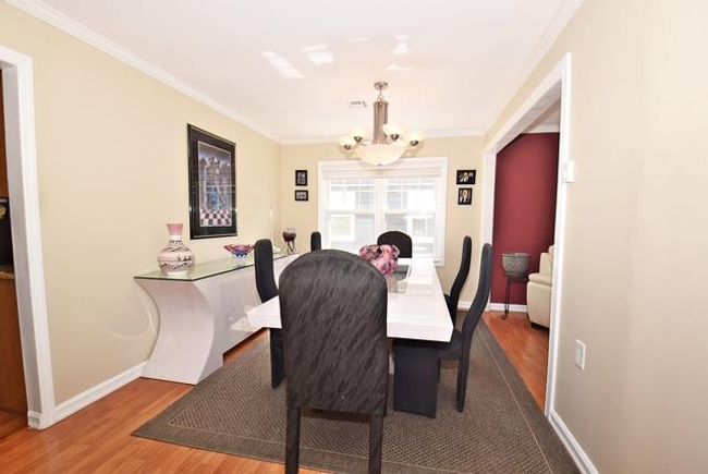Sunroom featuring a wealth of natural light | Image 12