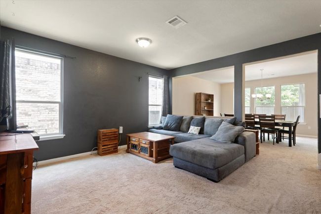 Living room is open to dining​​‌​​​​‌​​‌‌​‌‌​​​‌‌​​‌‌​‌​​​​​‌ area. | Image 14