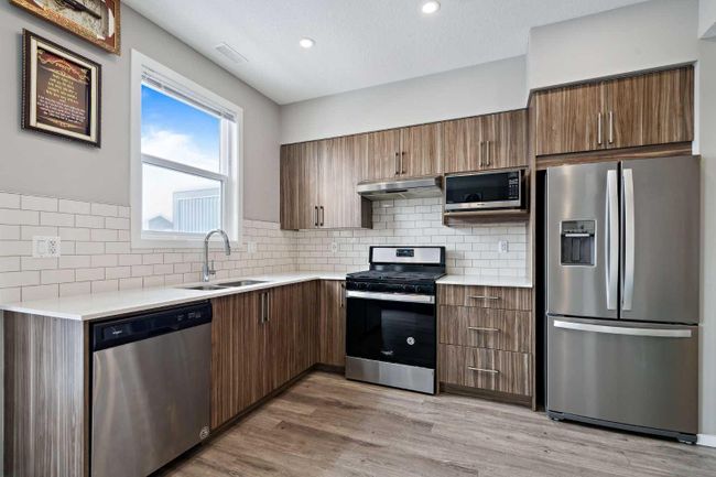 202 - 215 Redstone Ne, Home with 2 bedrooms, 2 bathrooms and 1 parking in Calgary AB | Image 4