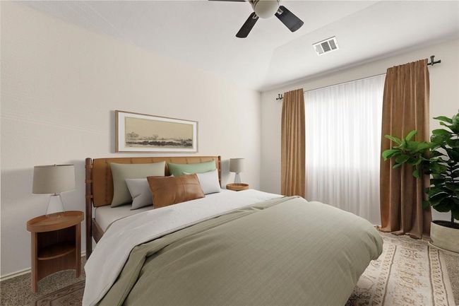 A peaceful and comfortable primary bedroom, ideal for relaxation. | Image 13