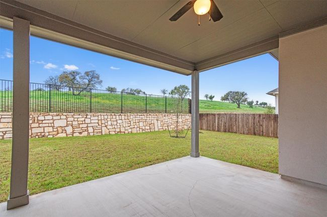 View of patio / terrace with ceiling fan and a fenced backyard | Image 34
