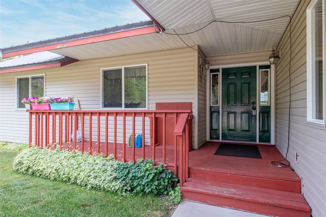 Property entrance featuring covered porch | Image 8