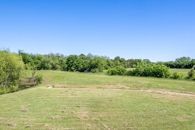 View of green lawn with a view of countryside | Image 30