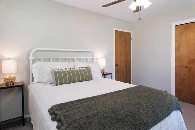 Bedroom featuring ceiling fan and carpet floors | Image 30