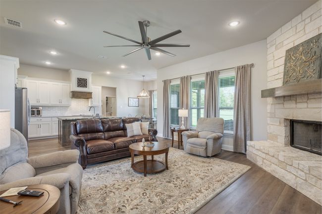 The fireplace is to be enjoyed from each area of the open concept living-kitchen-dining space. Country living at its best. | Image 14