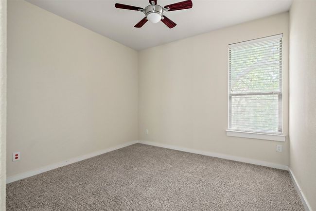 The upstairs guest bedrooms are bright and spacious, each offering ample room for furniture and personal touches, making them perfect for family, guests, or a home office | Image 26