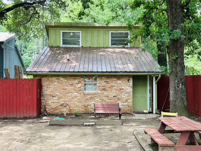 Back of property featuring a patio, brick siding, and a metal roof | Image 6