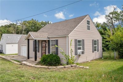 View of front of house with a front yard and a garage | Image 2