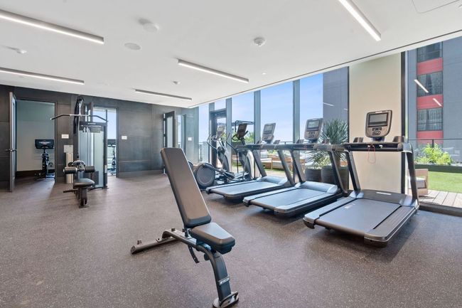 Gym with a wall of windows and plenty of natural light | Image 33
