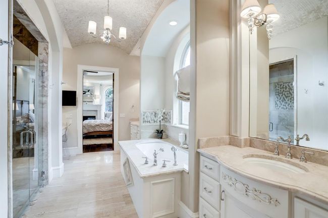 Primary bathroom with tub, large shower and double vanities. | Image 20