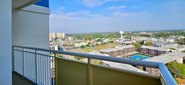 Balcony featuring a view of city | Image 23