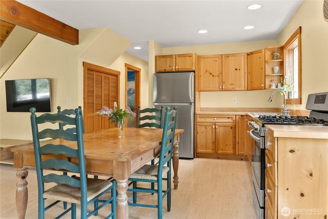 Warm and inviting kitchen with solid pine cabinetry and natural wood finishes | Image 26
