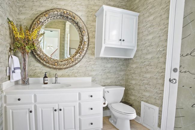 Bathroom with vanity and tile patterned flooring | Image 21