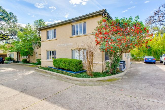 View of property exterior featuring brick siding and central AC unit | Image 6