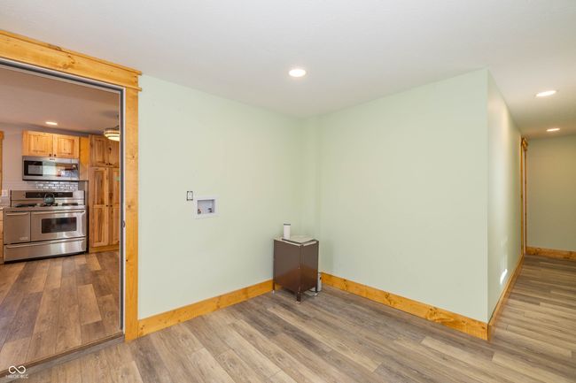 interior space featuring recessed lighting, baseboards, and light wood-style flooring | Image 10