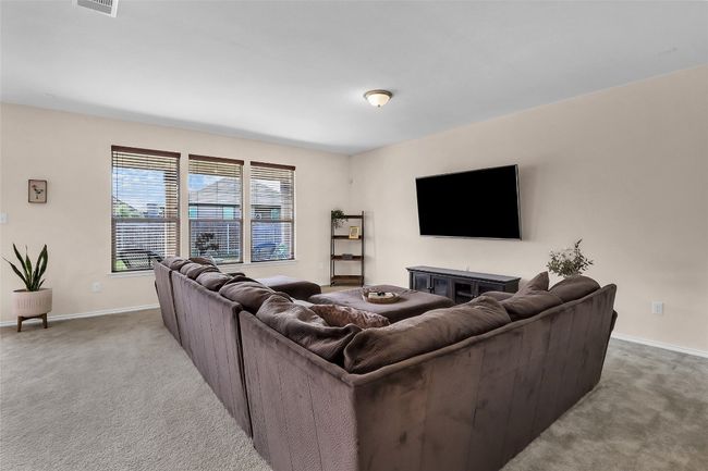 Living area with carpet and baseboards | Image 7