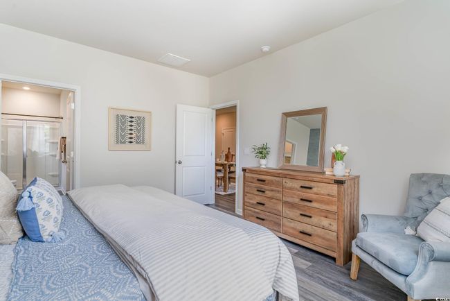 Bedroom with wood finished floors | Image 13