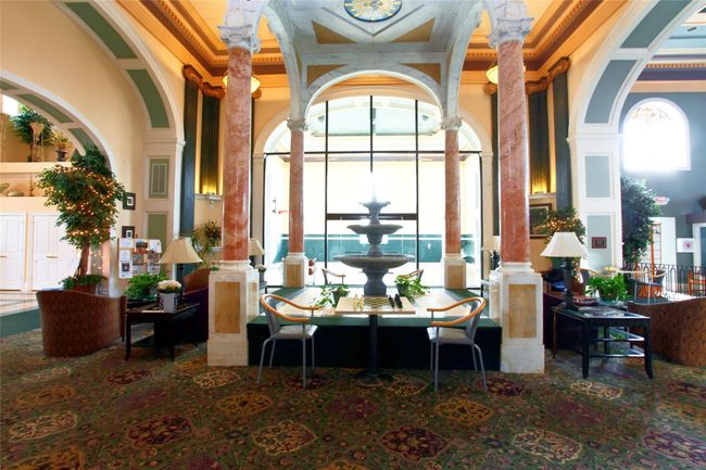 Community lobby with a towering ceiling and crown molding | Image 49