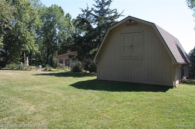 Back of barn, built into the hill, with second floor access door. | Image 60