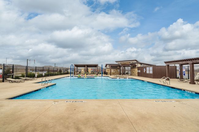Community pool with a patio and fence | Image 29