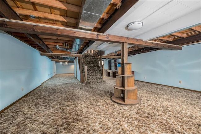 Finished basement with stairway, baseboards, and carpet flooring | Image 26