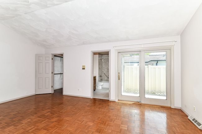 Primary Bedroom with Door to Private Patio. Huge Walk-in Closet. | Image 9