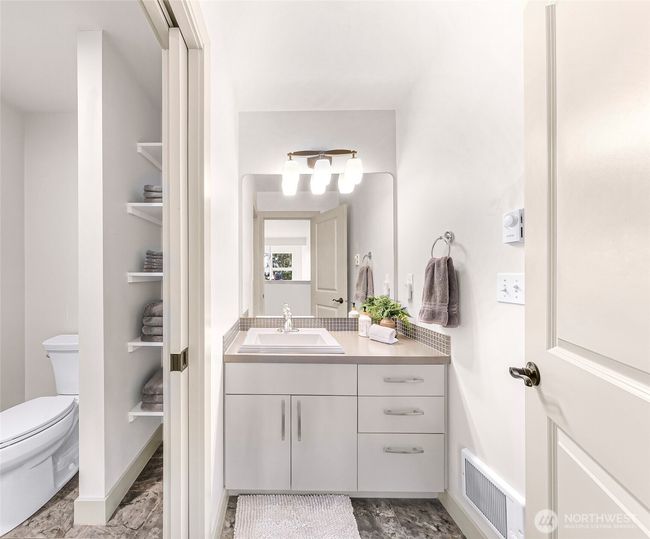 Full shared bathroom upstairs, privacy door for shower and toilet | Image 24