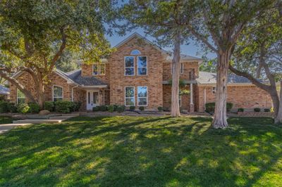 View of front of home with a balcony and a front lawn | Image 1