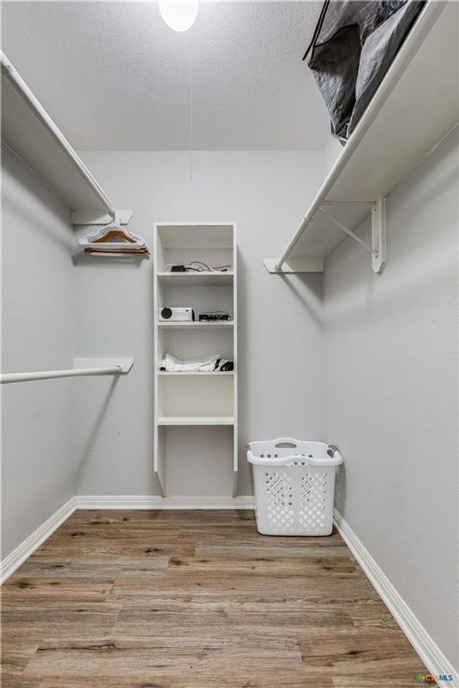 Spacious closet featuring wood finished floors | Image 31