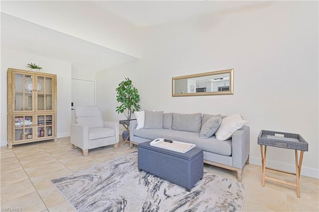 Tiled living room featuring baseboards | Image 8
