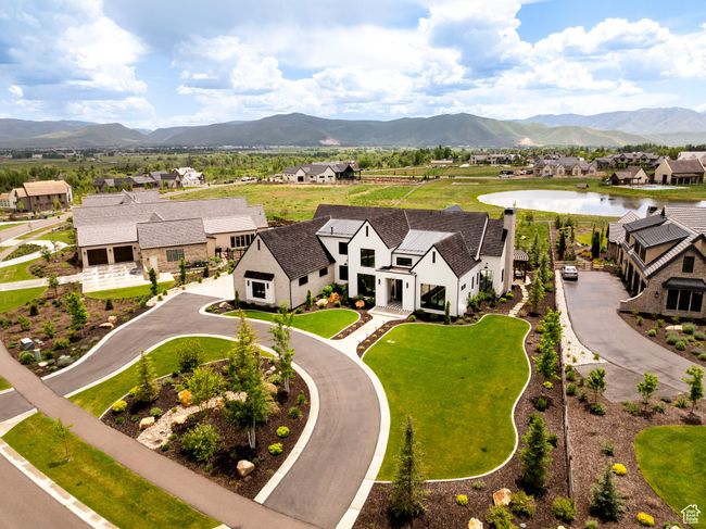 Aerial view of residential area featuring a water and mountain view | Image 66