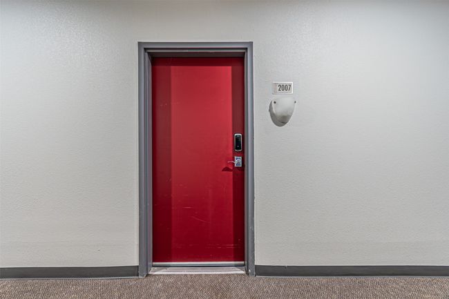 Entrance to property with stucco siding | Image 18