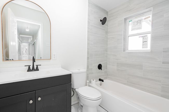 Full bath featuring vanity and shower / washtub combination | Image 22