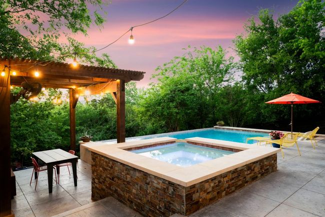 Relax in the custom hot tub. | Image 26