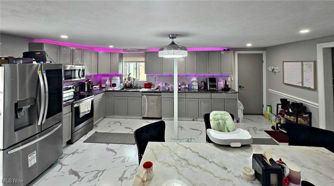 Kitchen with recessed lighting, marble finish floor, appliances with stainless steel finishes, and gray cabinetry | Image 21