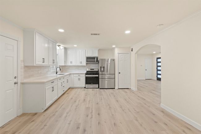 Unfurnished bedroom with light wood-style flooring, a closet, baseboards, and a ceiling fan | Image 8