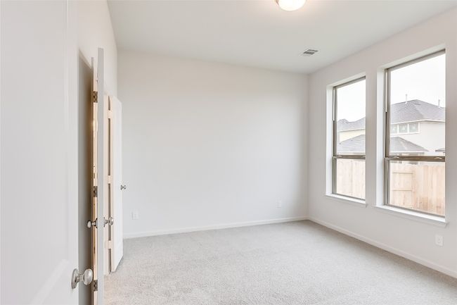 Spare room featuring light carpet and baseboards | Image 15