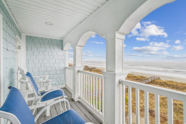 Balcony featuring view of water and beach | Image 31