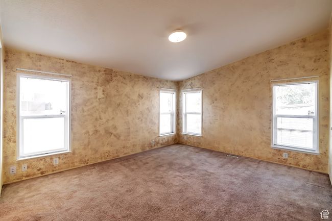 View of carpeted spare room | Image 11