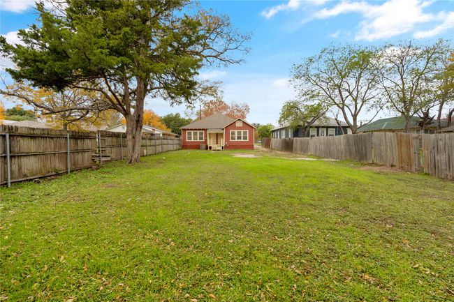 View of fenced backyard | Image 26