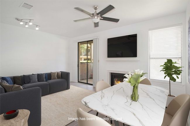 Virtually staged to show one option as to how you could arrange Living and Dining in this room. | Image 6
