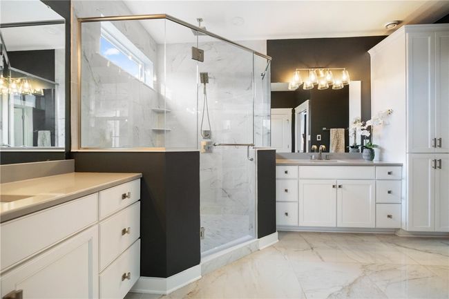 Roomy Owner's Suite Bathroom with 2 linen/storage closets. | Image 25