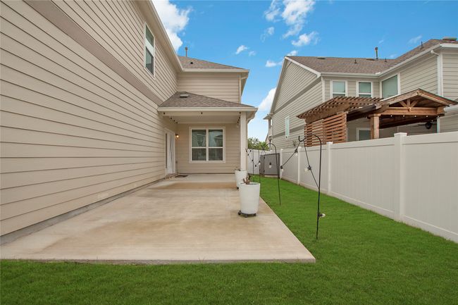 Fenced backyard featuring a pergola and a patio area | Image 33